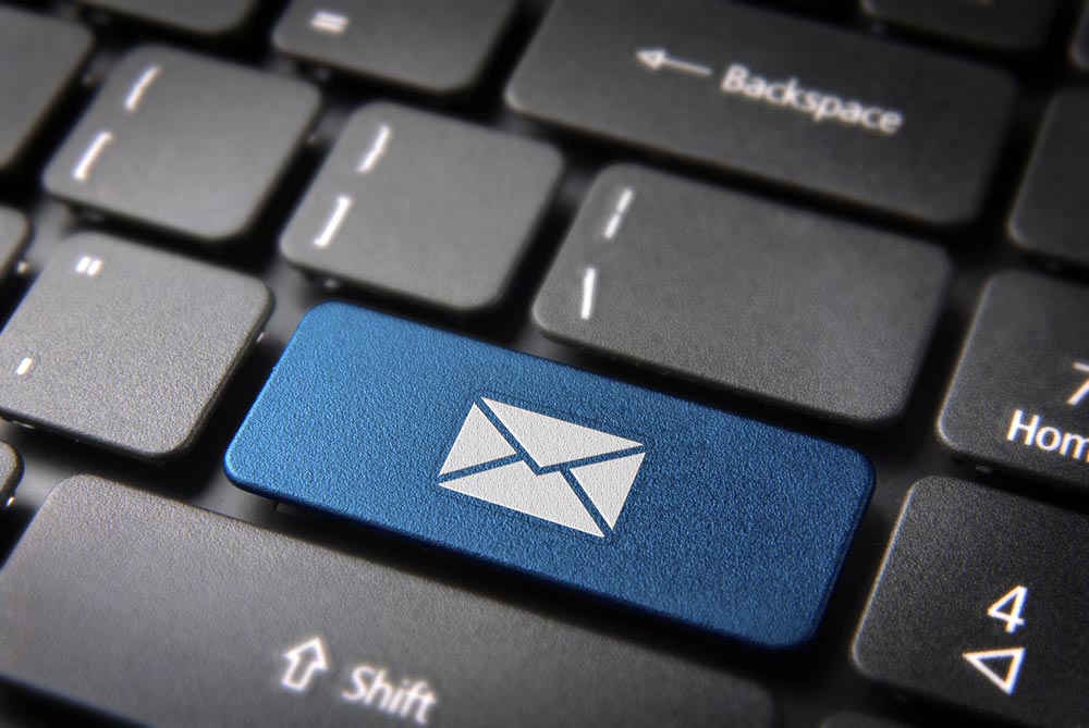 E-mailing Marketing campaign key with mailing envelope icon on laptop keyboard