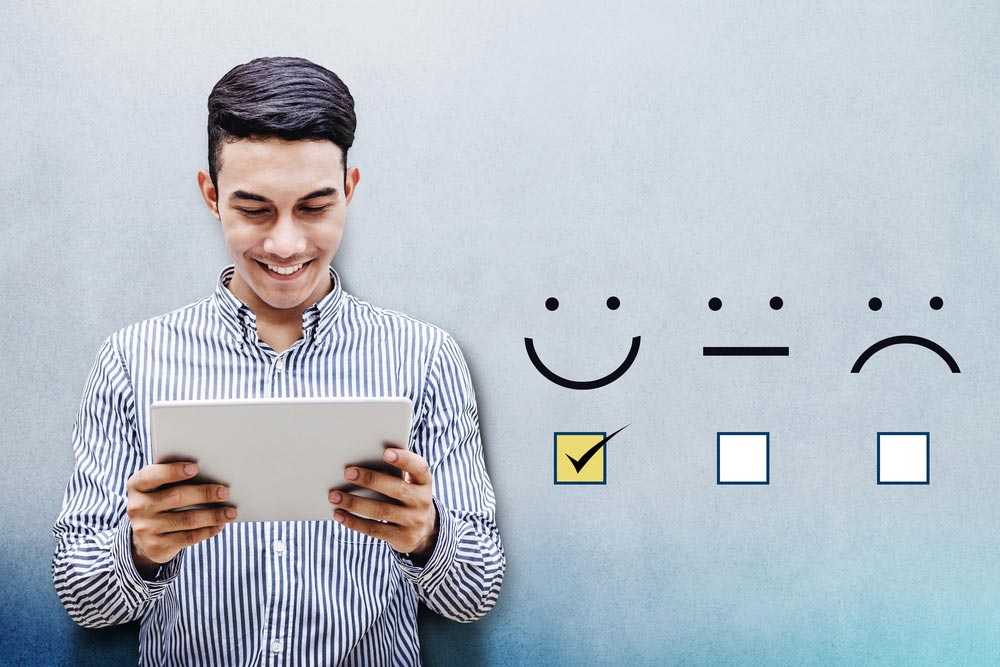 Happy Businessman holding digital Tablet