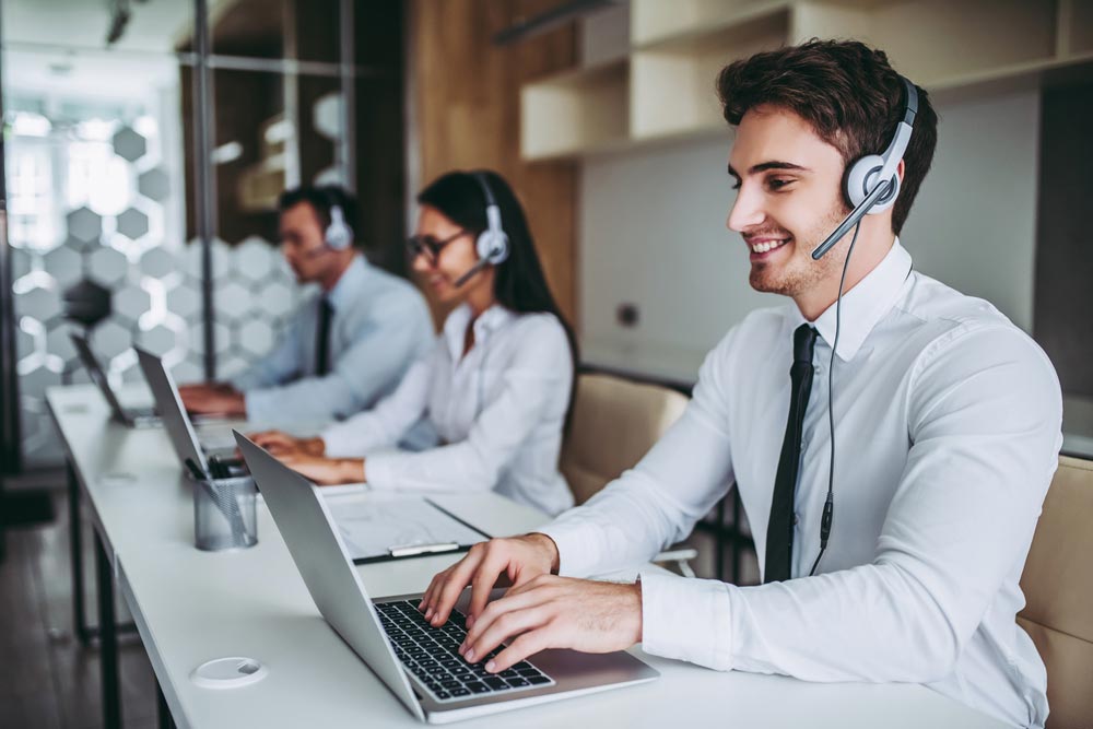 call center workers in headphones